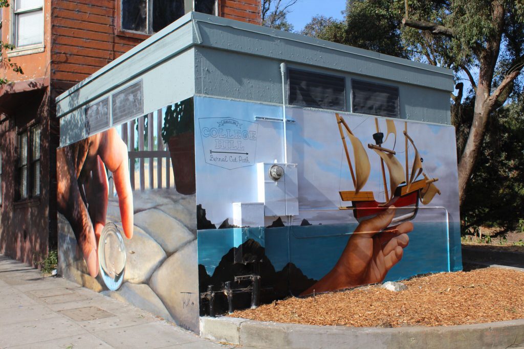 Photo of final mural at 3600 Mission St, depicting a large clear marble and wooden sail boat