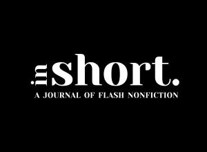 Black background with font in white of the Name of organization: In Short: A Journal of Flash Nonfiction